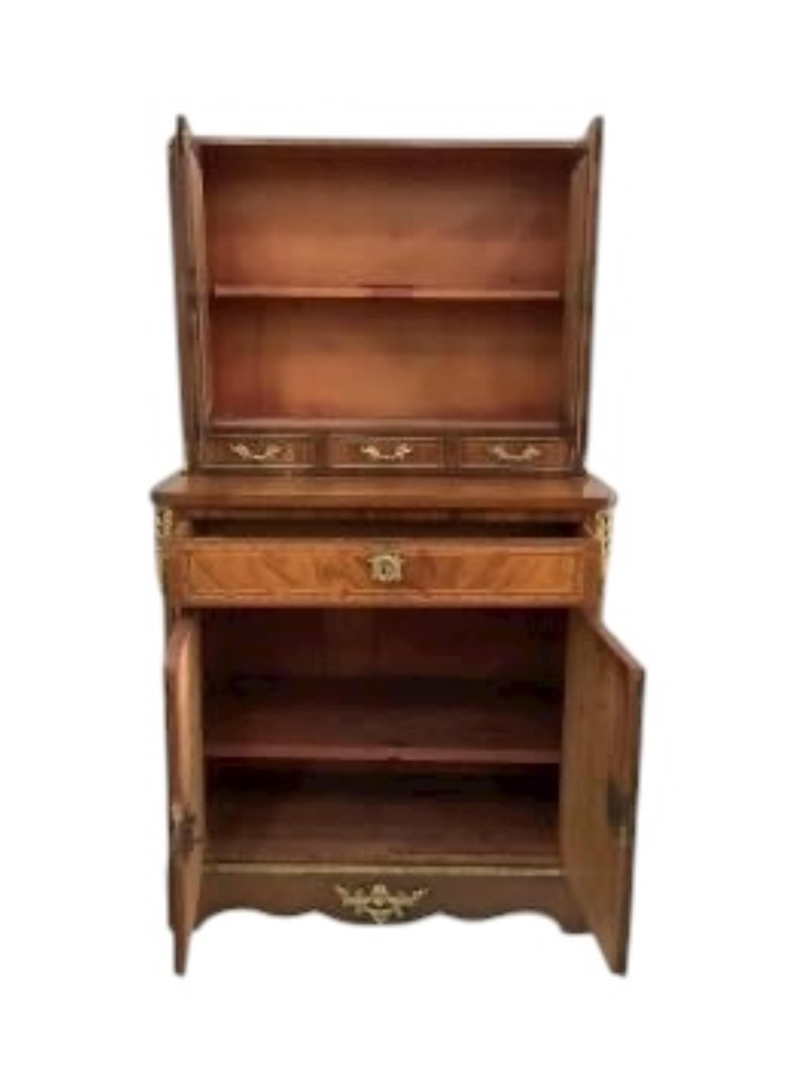 A Louis XVI style gilt metal mounted walnut and mahogany side cabinet, width 80cm, depth 37cm, height 142cm
